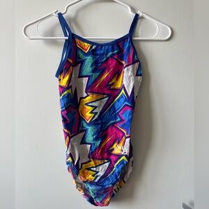 Salute Leotard: “POW” Signature Leotard by Hallie Thompson